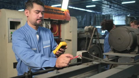 Engineer teams inspect machines' electric current at the industry factory. Stock-Footage 197222203