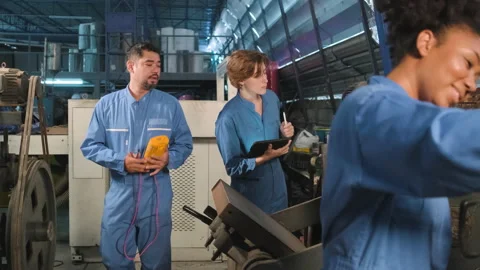 Engineer teams inspect machines' electric current at the industry factory. Stock-Footage 201853446