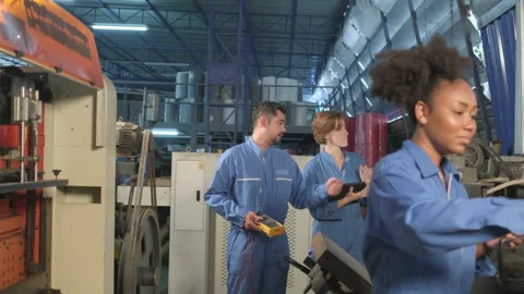 Engineer teams inspect machines' electric current at the industry factory. Stock-Footage 202470521