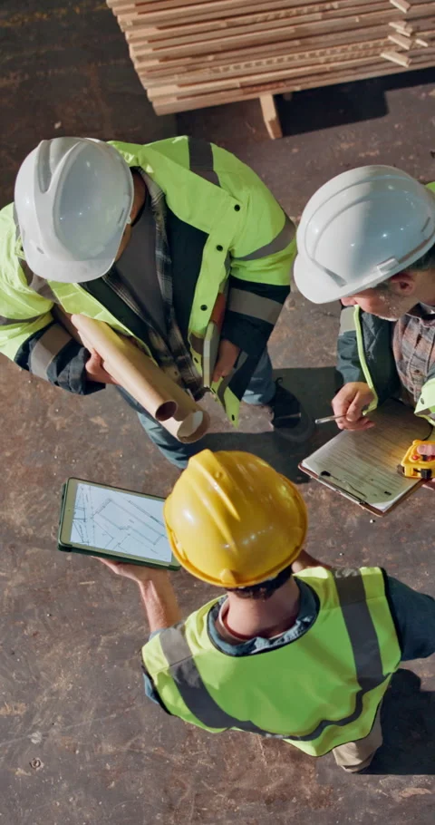 Engineer, teamwork and men with tablet in building, above or planning for Stock Footage 348728697
