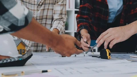 Engineer Teamwork Meeting, Drawing working on blueprint meeting for project.. Stock Footage 242641797