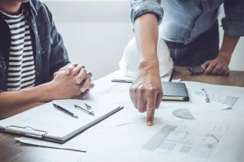 Engineer Teamwork Meeting, Drawing working on blueprint meeting for project w Stock Photos