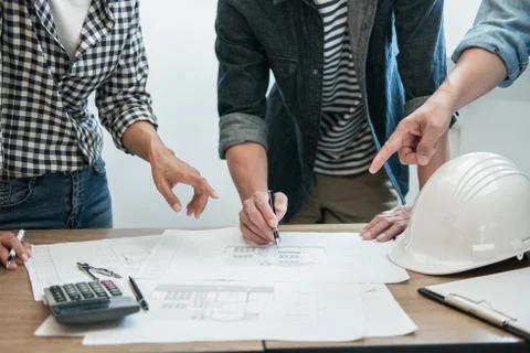 Engineer Teamwork Meeting, Drawing working on blueprint meeting for project w Stock Photos
