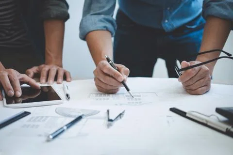 Engineer Teamwork Meeting, Drawing working on blueprint meeting for project w Stock Photos