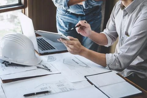 Engineer Teamwork Meeting, Drawing working on blueprint meeting for project w Stock Photos