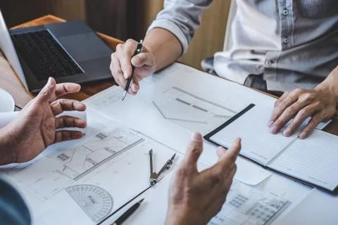 Engineer Teamwork Meeting, Drawing working on blueprint meeting for project w Stock Photos