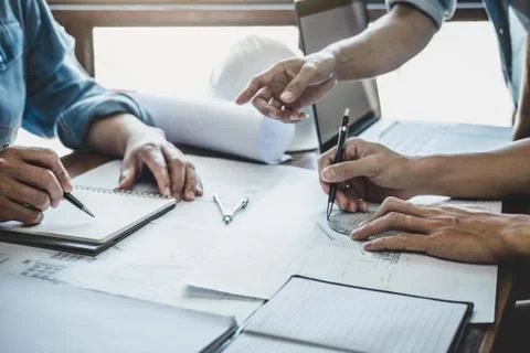 Engineer Teamwork Meeting, Drawing working on blueprint meeting for project w Stock Photos