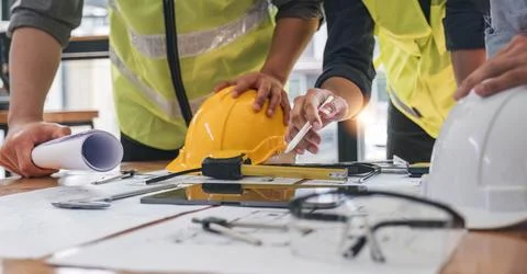 Engineer Teamwork Meeting, Drawing working on blueprint meeting for project Stock Photos