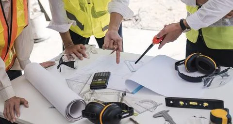 Engineer Teamwork Meeting, Drawing working on blueprint meeting for project Stock Photos