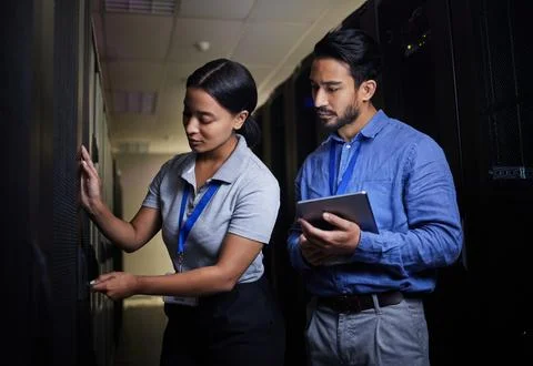 Engineer teamwork, server room and woman opening panel for maintenance or Stock Photos