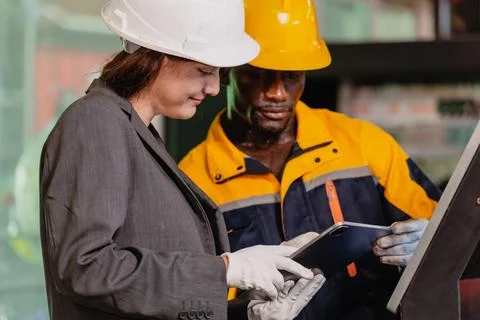 Engineer teamwork, Worker man and woman team working together in metal work.. Foto stock