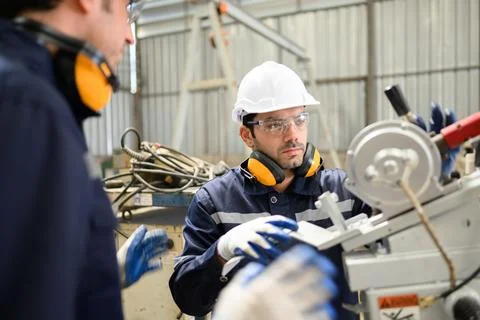 Engineer technician controlling robotic arms on computer laptop Stock Photos