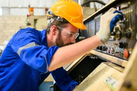 Engineer technician controlling robotic arms on computer laptop Foto stock