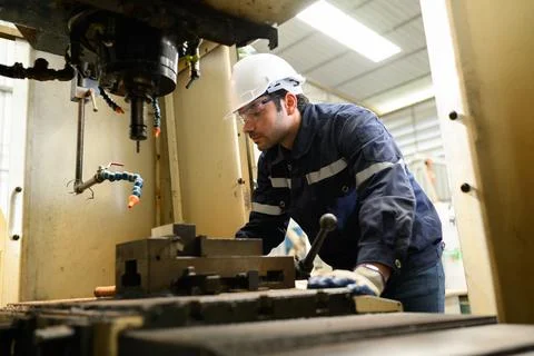 Engineer technician controlling robotic arms on computer laptop Stock Photos