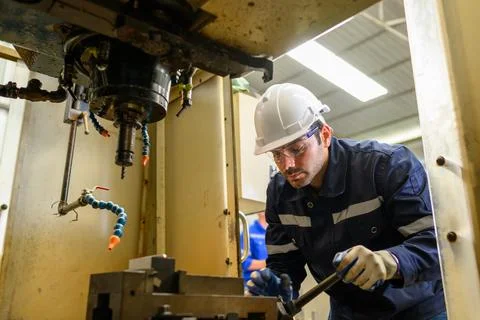 Engineer technician controlling robotic arms on computer laptop Stock Photos