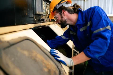 Engineer technician controlling robotic arms on computer laptop Stock Photos