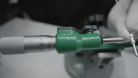 Engineer technician handling a micrometer tool with precision for accurate me Stock Footage 331891479