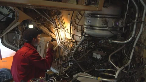Engineer technician inspects the inside of the aircraft with a flashlight. Видео 98001540