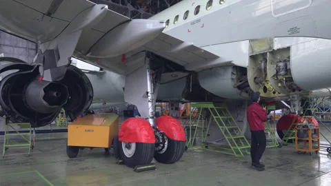 Engineer technician inspects the inside of the aircraft with a flashlight.4k Stock Footage 107295359