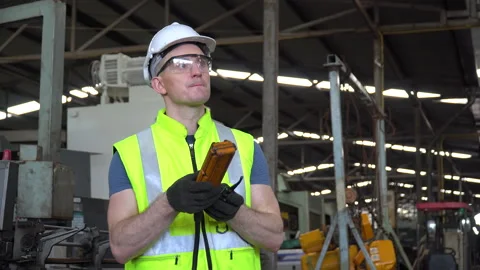 Engineer technician manager   controlling by remote control with heavy mach.. Stock Footage 246987356