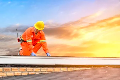 Engineer technician watching team of workers on high steel platform Stock Photos
