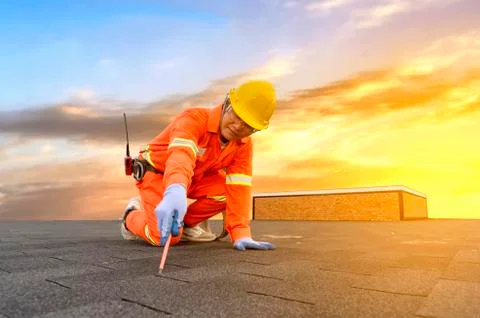 Engineer technician watching team of workers on high steel platform Stock Photos