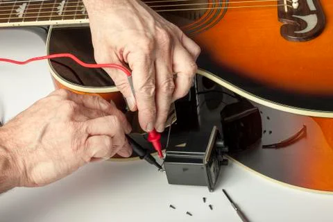 Engineer testing an acoustic guitar amplifier Stock Photos
