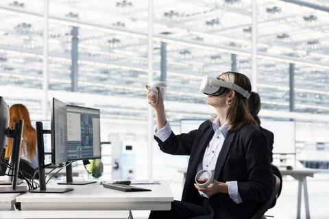 Engineer testing microchip electronics prototypes using VR technology Stock Photos