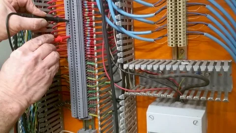 Engineer testing a panel with electrical probes Stock Footage 96434568