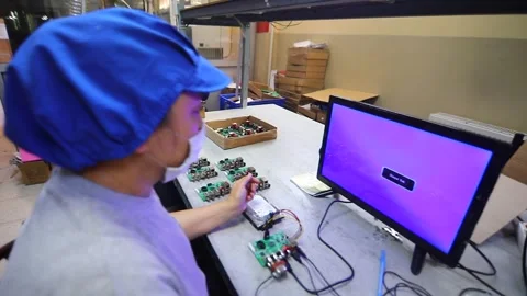 The engineer tests the motherboard Stock Footage 247059196