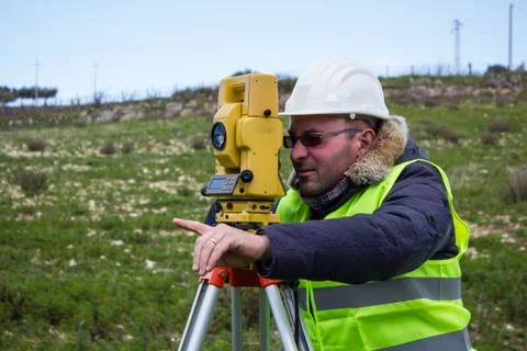 Engineer with a theodolite for measuring topographic Stock Photos
