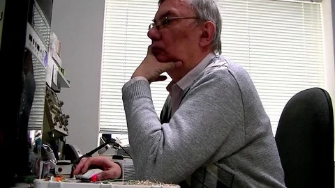 Engineer thinks looking at computer Stock Footage 72458609