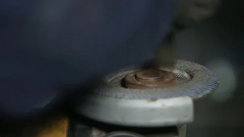 Engineer tightens angle grinder Stock Footage 71822044