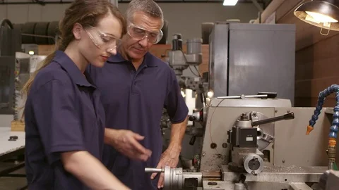 Engineer Training Female Apprentice On Lathe  Stock Footage 72512465