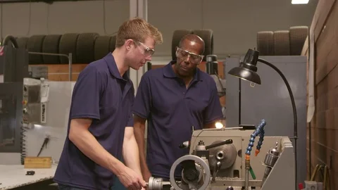 Engineer Training Male Apprentice On Lathe  스톡 동영상 72512482