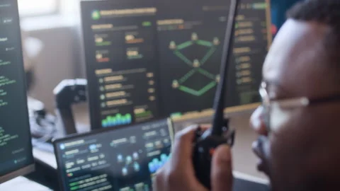 Engineer Transmitting Network Data on Radio Using Computers in Office 動画素材 334932570