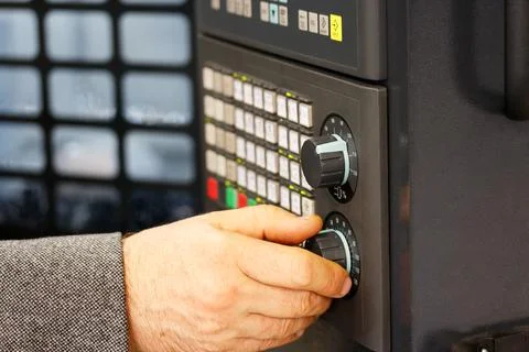 Engineer tunes parameters of CNC machine Stock Photos