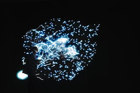 Engineer tuning AI model synaptic weights with tablet to accelerate processing Stock Photos