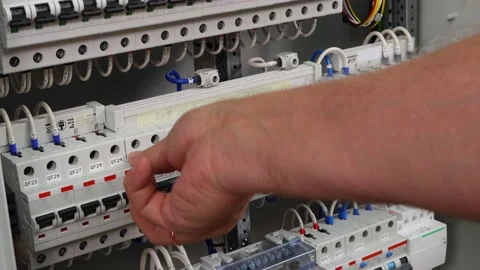 The engineer turns on and off the automatic protection. Stock Footage 157503561