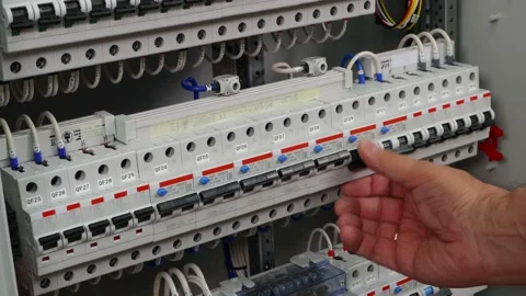 The engineer turns on and off the automatic protection. Stock Footage 157504502