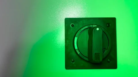 A engineer turns on switch on an electrical panel Stock Footage 252043022