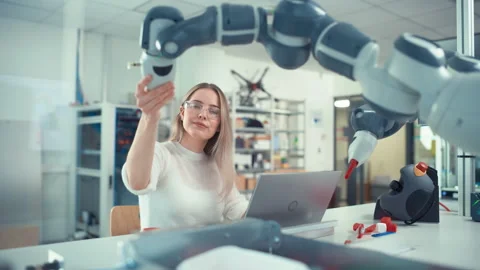 Engineer Type At Laptop And Move Bionic Claw Stock Footage 187571914