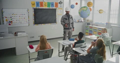 Engineer in Uniform Giving Lecture to Curious Primary School Students About Stock Footage 316054339