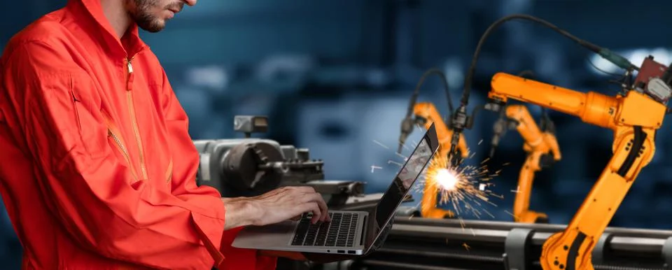 Engineer use advanced robotic software to control industry robot arm in factory 스톡 사진