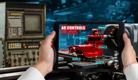 Engineer use augmented reality software in smart factory production line Stock Photos