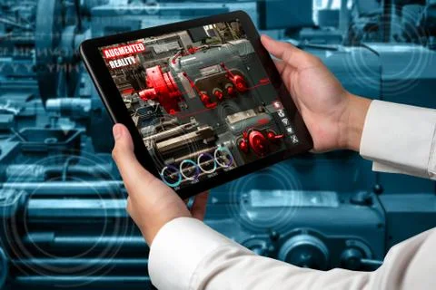 Engineer use augmented reality software in smart factory production line Stock Photos