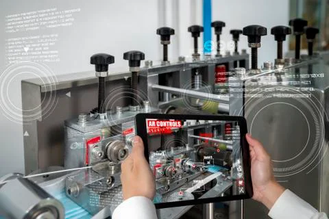 Engineer use augmented reality software in smart factory production line Stock Photos