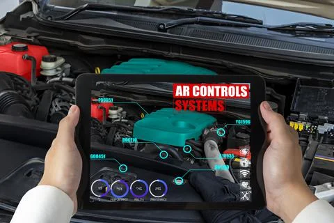 Engineer use augmented reality software to monitor parts of car vehicle 写真素材