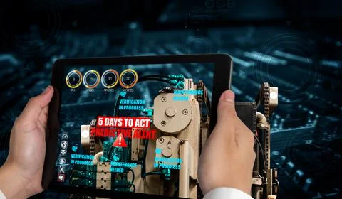 Engineer use augmented reality software in smart factory production line Stockfoto's
