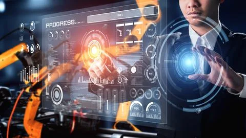 Engineer use cybernated robotic software control industry robot arm in factory Stock Photos